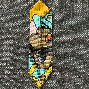 Indigenous Amazonian beadwork of Luigi from Super Mario Brothers
